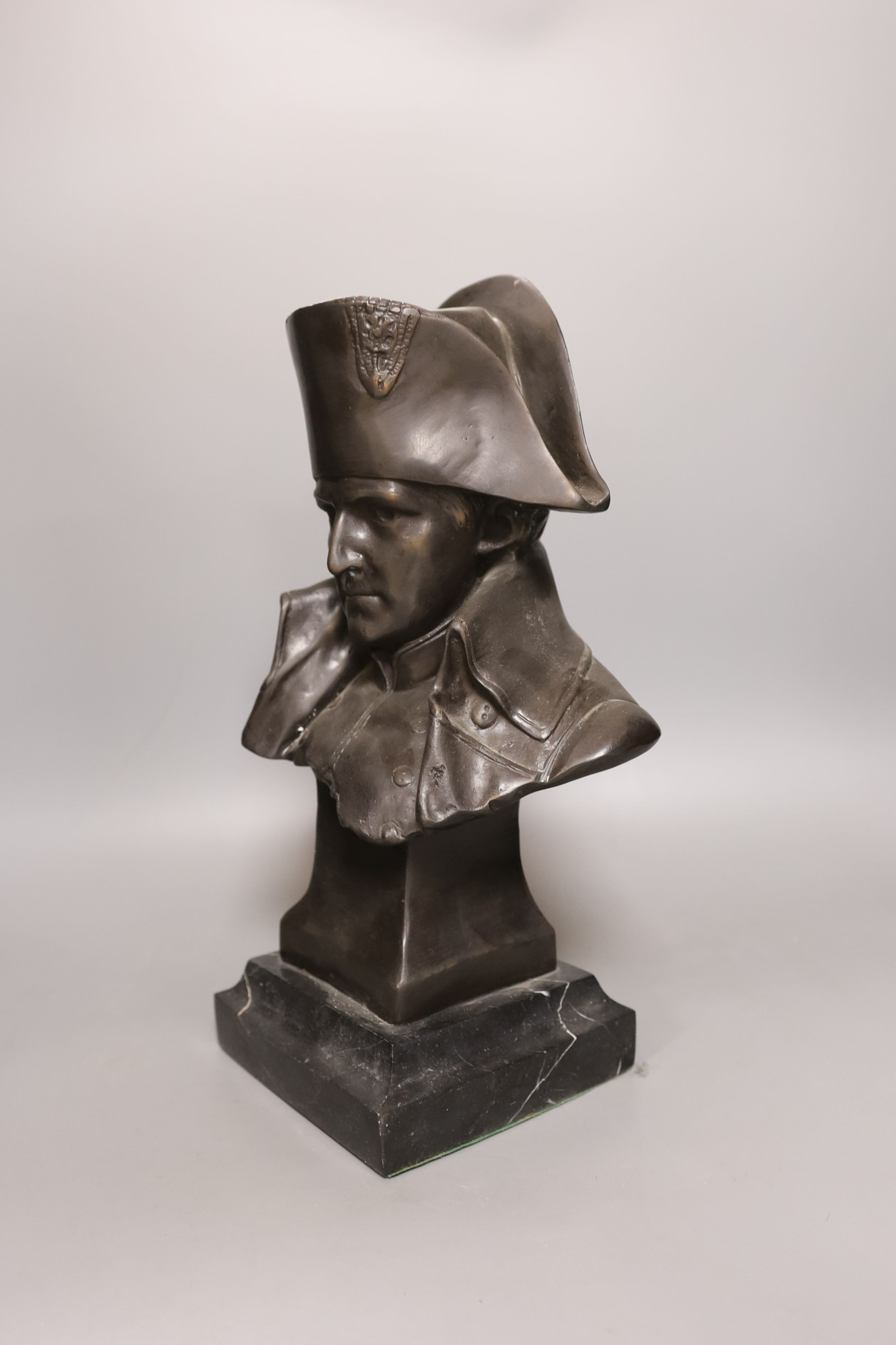 A bronze portrait bust of Napoleon, bearing script mark verso Lecomte 82, on marble plinth, 36cm